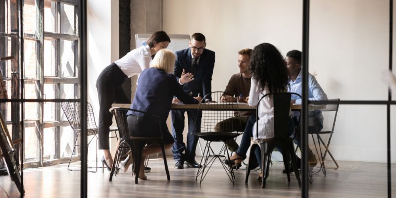 14-ways-attorneys-can-use-mcas group of attorneys collaborating at growing law firm